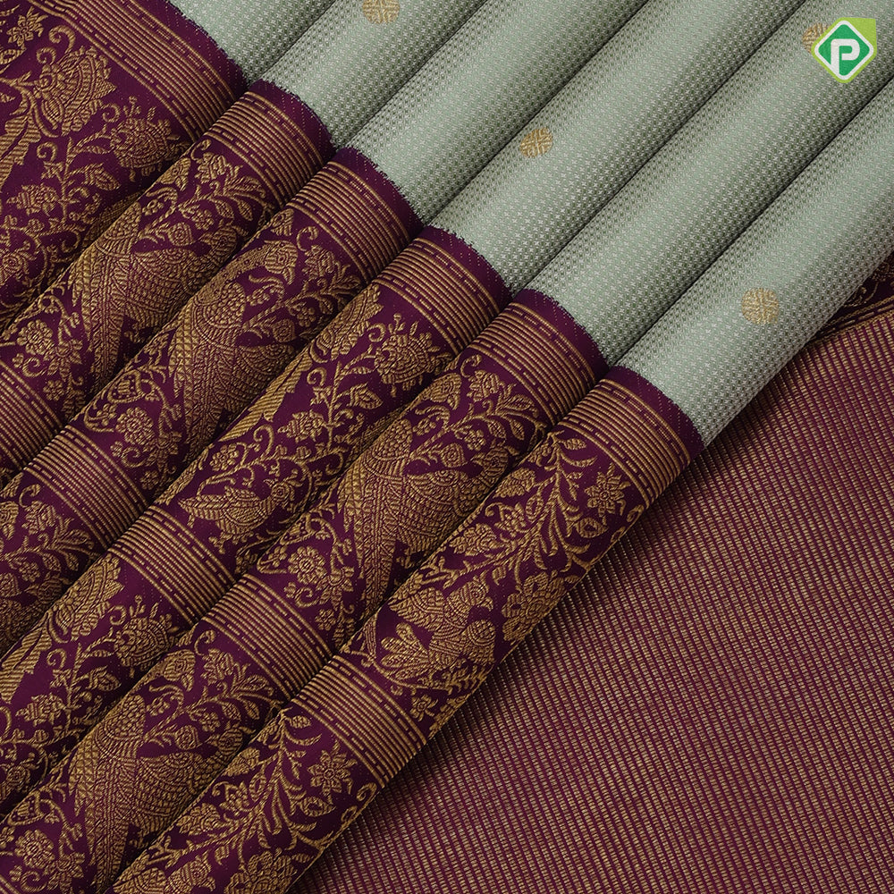 Pista green self designed stripes gold zari chakkaram butta contrast purple gold zari double peacock banaras style border fusion silk saree