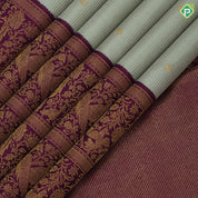 Pista green self designed stripes gold zari chakkaram butta contrast purple gold zari double peacock banaras style border fusion silk saree