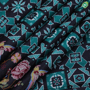 Black base trending color geometrical pattern self multi color embroidered border fancy dola silk saree