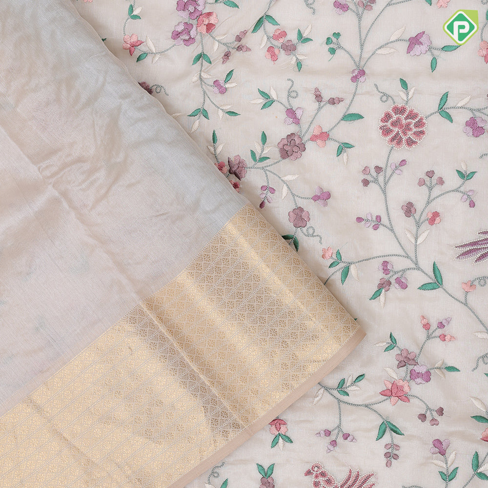 cream base multi color floral embroidered design peach cream gold zari star diamond lines border kora silk saree