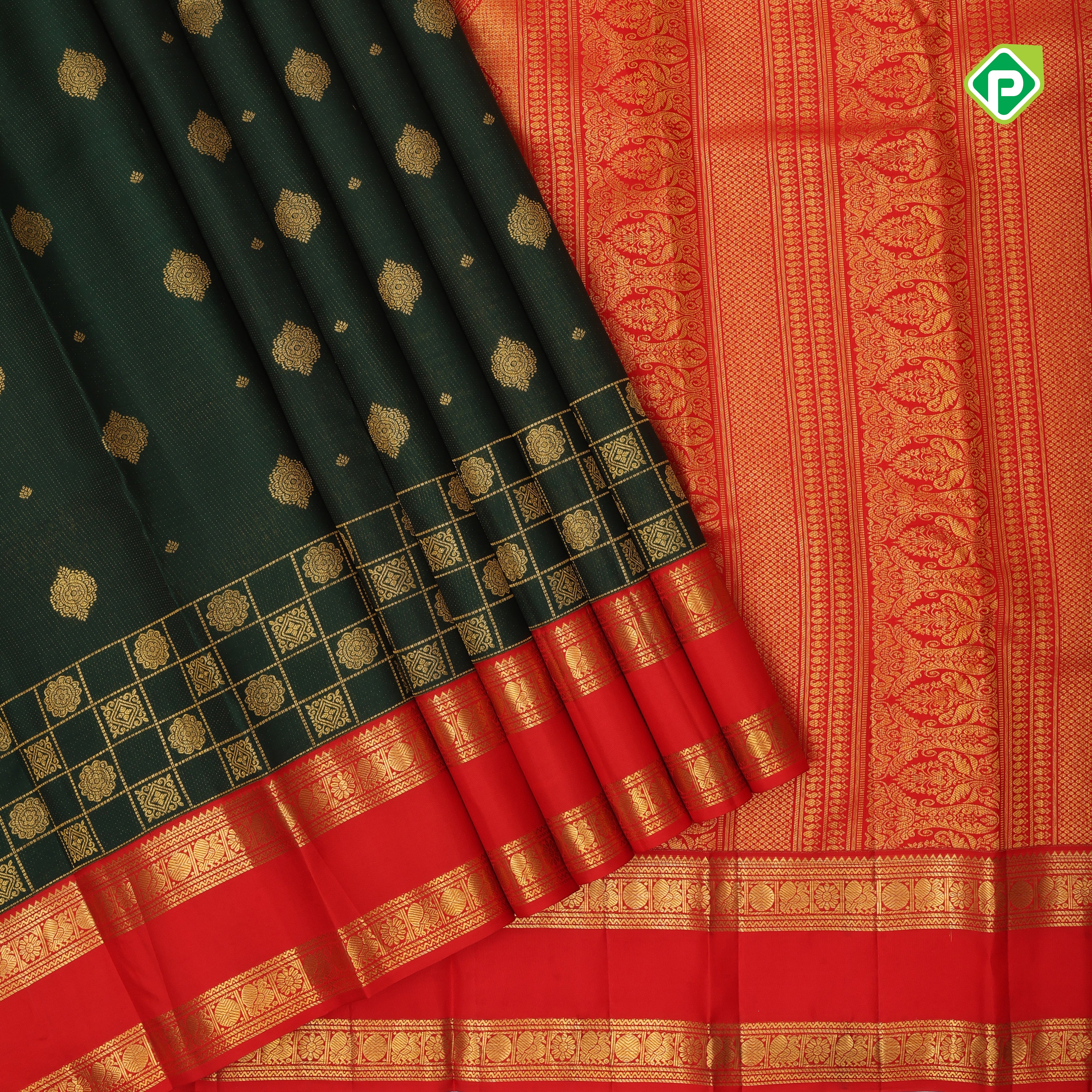 Deep green gold zari flower butta design contrast chilly red gold zari rettapet border grand bridal silk saree