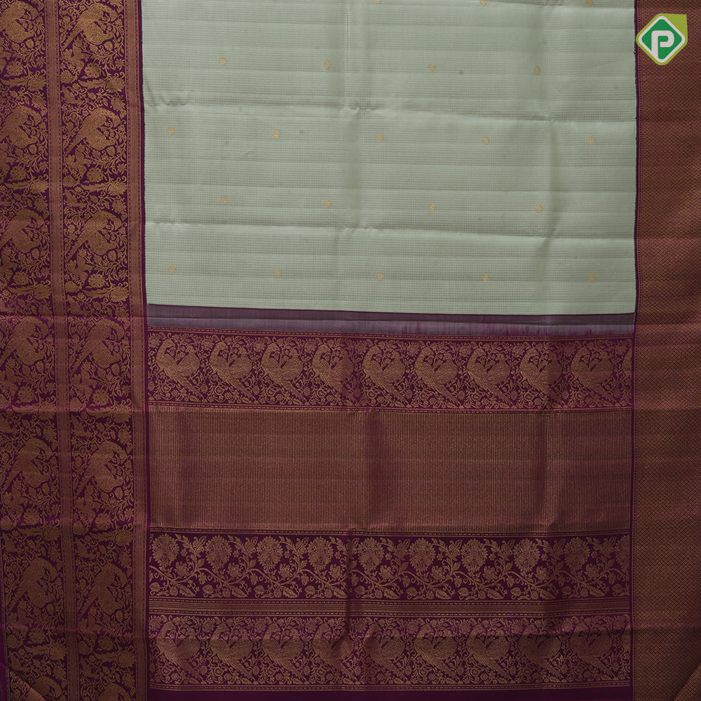 Pista green self designed stripes gold zari chakkaram butta contrast purple gold zari double peacock banaras style border fusion silk saree