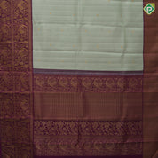 Pista green self designed stripes gold zari chakkaram butta contrast purple gold zari double peacock banaras style border fusion silk saree
