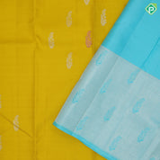 Lemon yellow silver zari fancy flower butta self silver zari and multi color butta border traditional silk saree