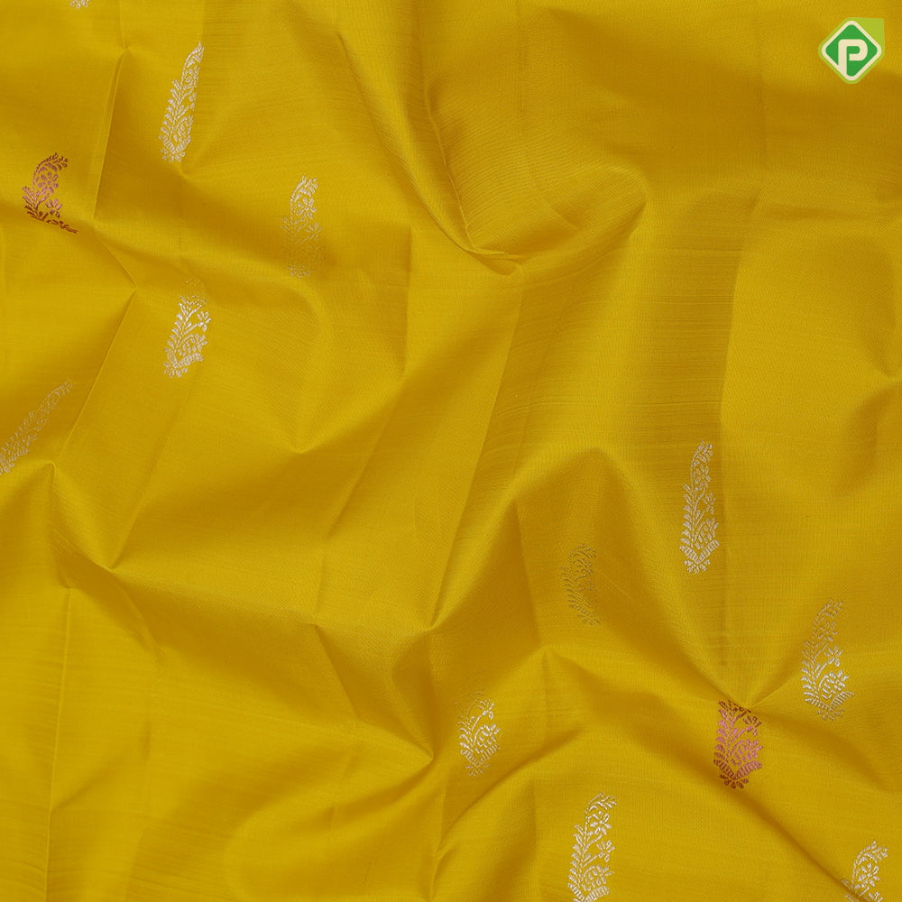 Lemon yellow silver zari fancy flower butta self silver zari and multi color butta border traditional silk saree