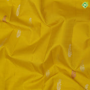 Lemon yellow silver zari fancy flower butta self silver zari and multi color butta border traditional silk saree