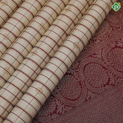 creamy sandal base maroon thread gold zari checks and butta maroon meena work border vintage traditional silk saree