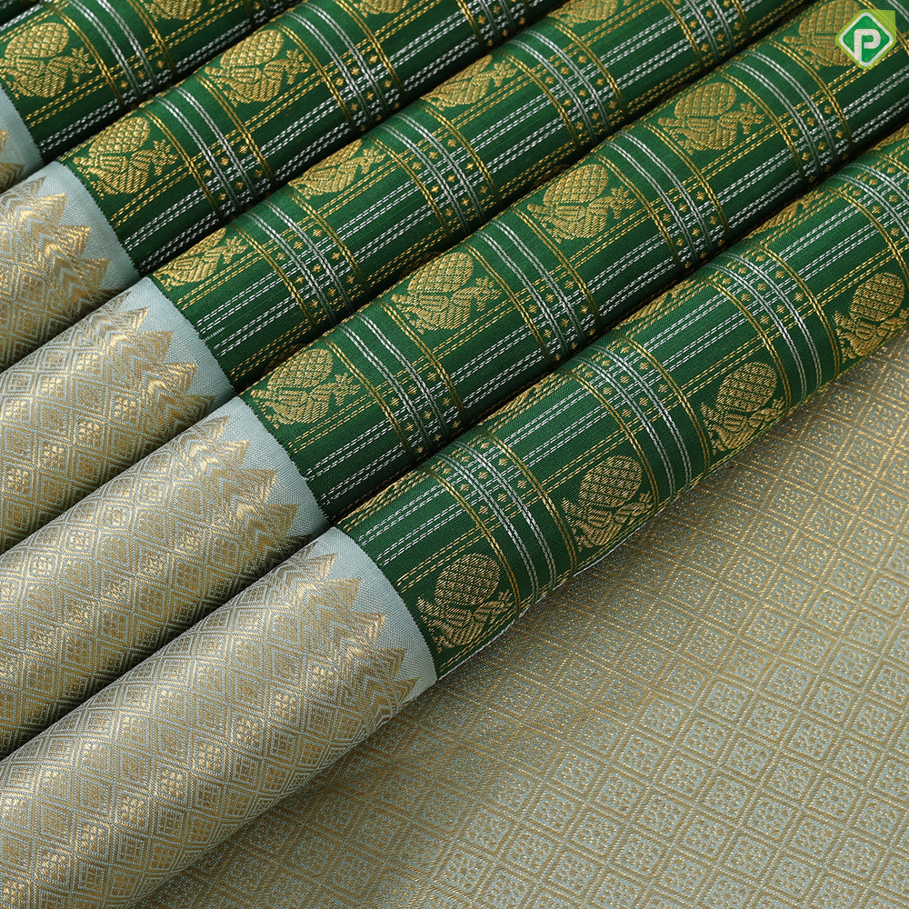 Dark green with peacock butta silver and gold zari checkered sea foam green border traditional silk saree
