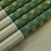 Dark green with peacock butta silver and gold zari checkered sea foam green border traditional silk saree