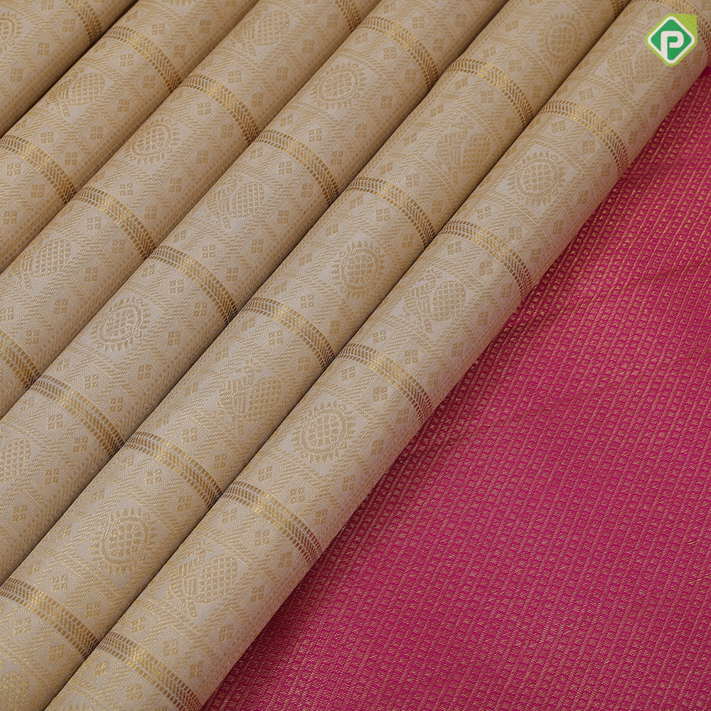 creamy sandal gold zari grand buttas filled checks contrast pink gold zari double peacock arch design border grand bridal silk saree