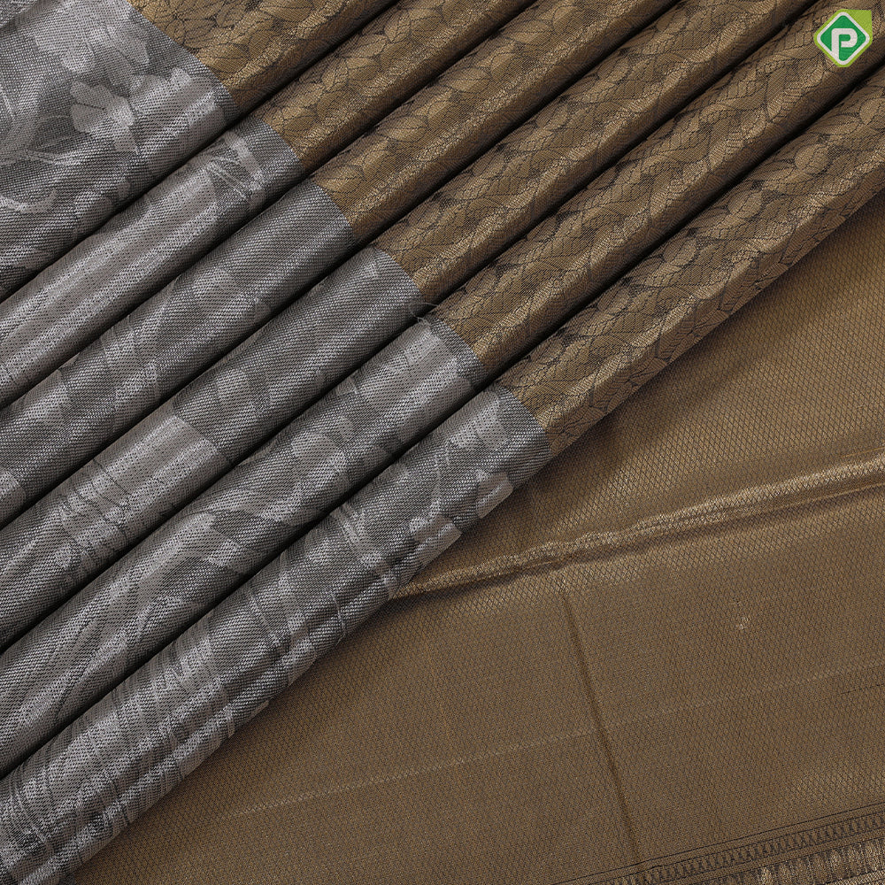 Golden yellow grand waves zari by zari weaved design Greyish self art effect scenery border trendy tissue silk saree