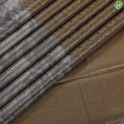 Golden yellow grand waves zari by zari weaved design Greyish self art effect scenery border trendy tissue silk saree