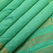 Rexona green plain weaved design self color gold zari edge border madisar 9 yards silk saree