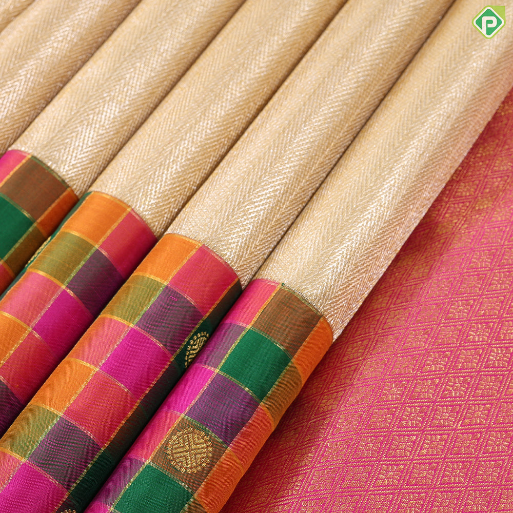Creamy gold zari by zari weaved design multi colour checks border Traditional silk saree