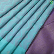Sea blue lavender zig zag embossed design self meena work big butta border trendy silk saree