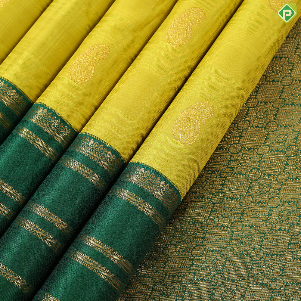 Lemon yellow with mango butta design dark green gold zari multi lines border Traditional silk saree