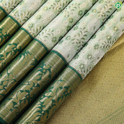 green base with silver and gold zari grand hand woven gold zari lotus design border exclusive bridal silk saree