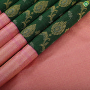 Forest green gold zari grand floral design contrast pale pink gold zari border grand bridal silk saree