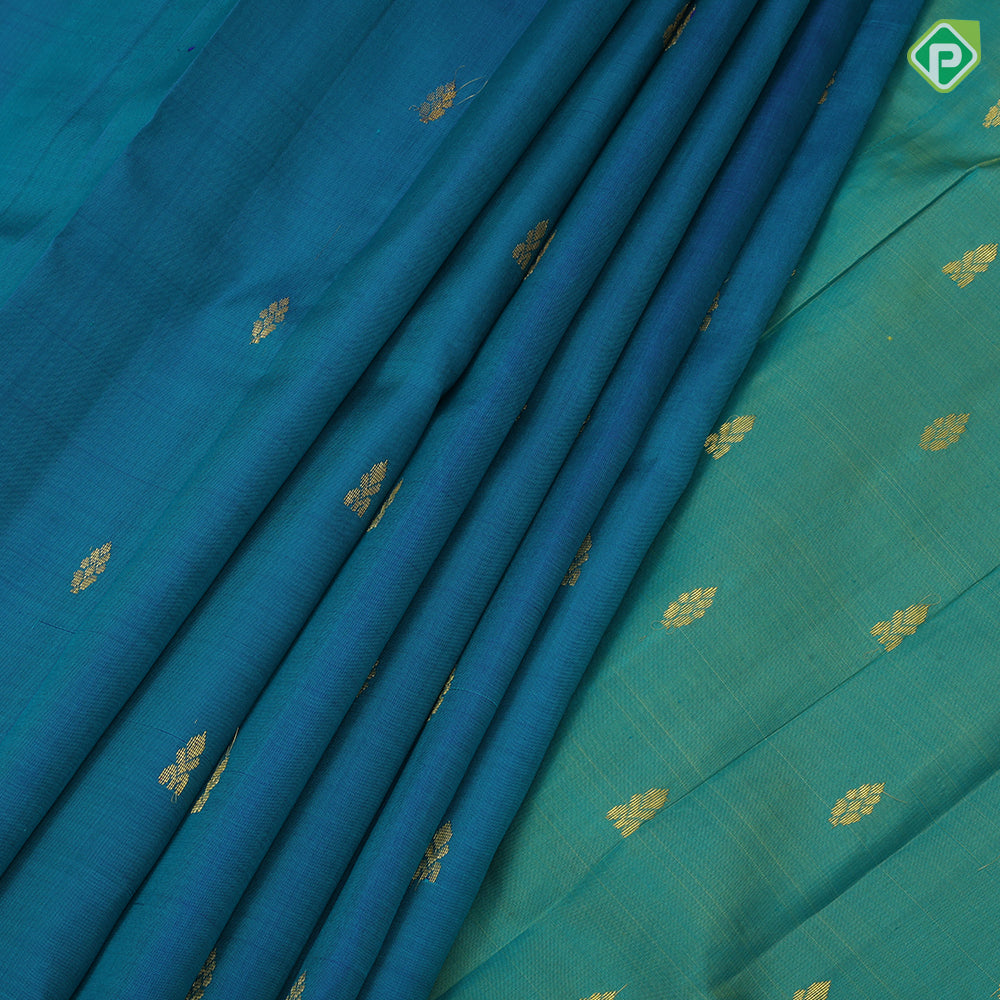 peacock blue gold zari fancy butta contrast green gold zari one side border silk saree