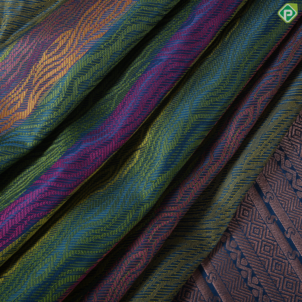 Multi color embossed flames design peacock blue copper zari border trendy silk saree