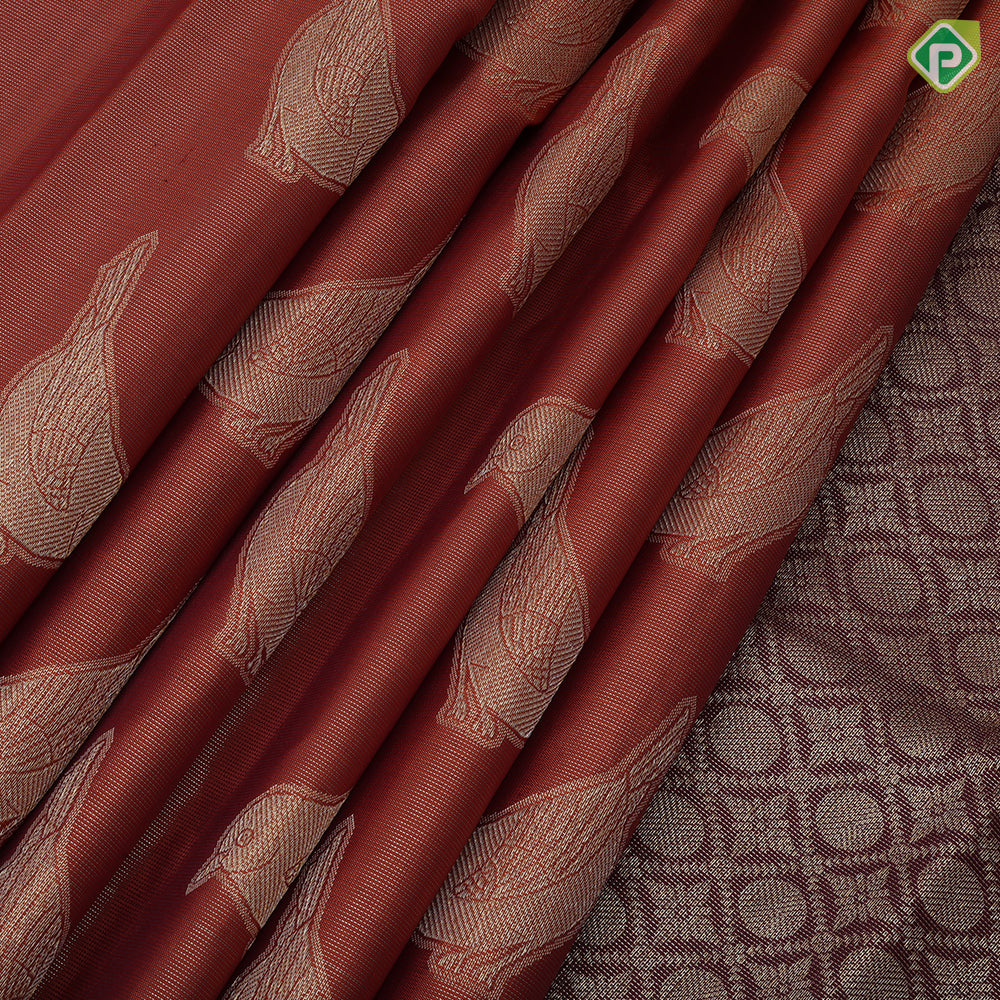 Rust orange tissue weave sparrow butta design contrast maroon gold zari rangoli mid border traditional silk saree