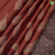 Rust orange tissue weave sparrow butta design contrast maroon gold zari rangoli mid border traditional silk saree