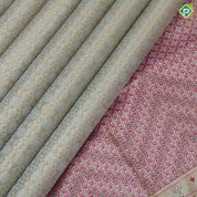 Mint green silver gold zari geometrical brocade design contrast rani pink gold zari wild effect pythonic design border grand tissue silk saree