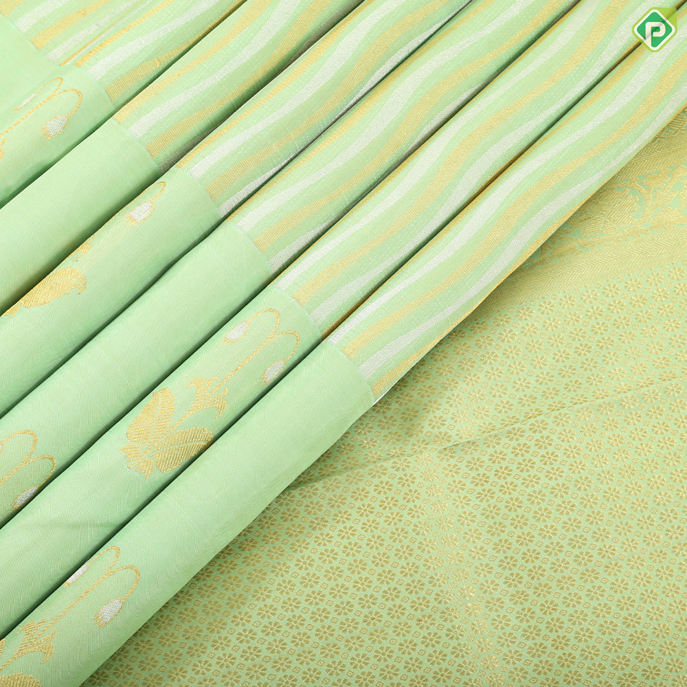 Pista green silver gold zari waves stripes design self gold zari flower tower fancy border trendy silk saree