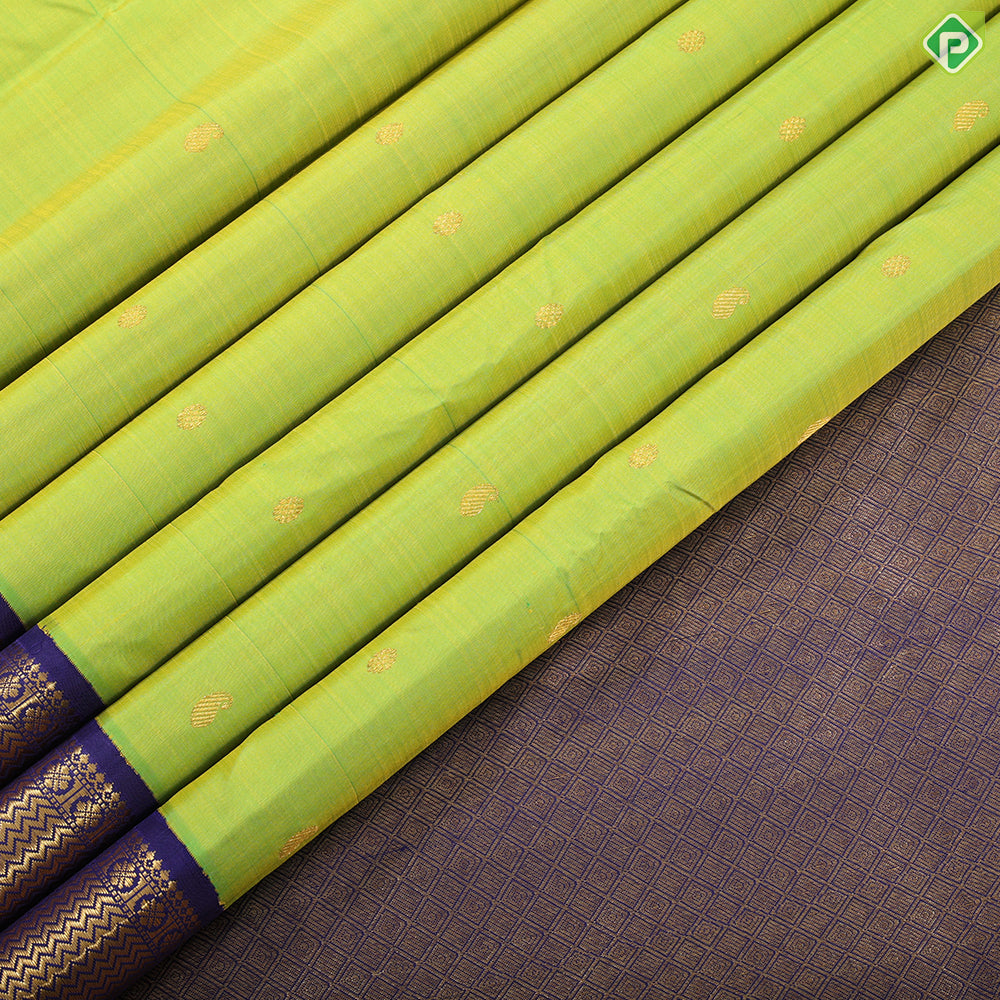 Lemon green gold zari mango butta design indigo blue with gold zari zig zag mid rettapet border traditional silk saree