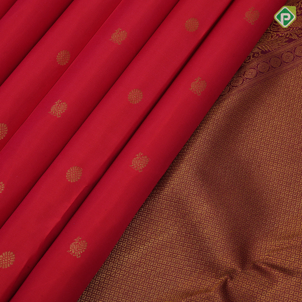 Rani pink gold zari peacock chakaram design purple wave border design traditional silk saree