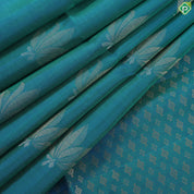 Peacock blue fancy lotus butta design self gold zari border grand pallu soft silk saree