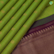 parrot green gold zari  peacock checks design  purple colour vairaoosi peacock and mango border design traditional silk saree