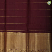 Rust orange gold zari checks and fancy butta brown gold zari particles design pattu paavadai lehanka