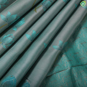 greyish green lotus flower embossed design peacock green gold zari border trendy silk saree