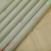 Pista green rose gold neem zari fancy flower butta motifs self tuning floral border trendy designer silk saree
