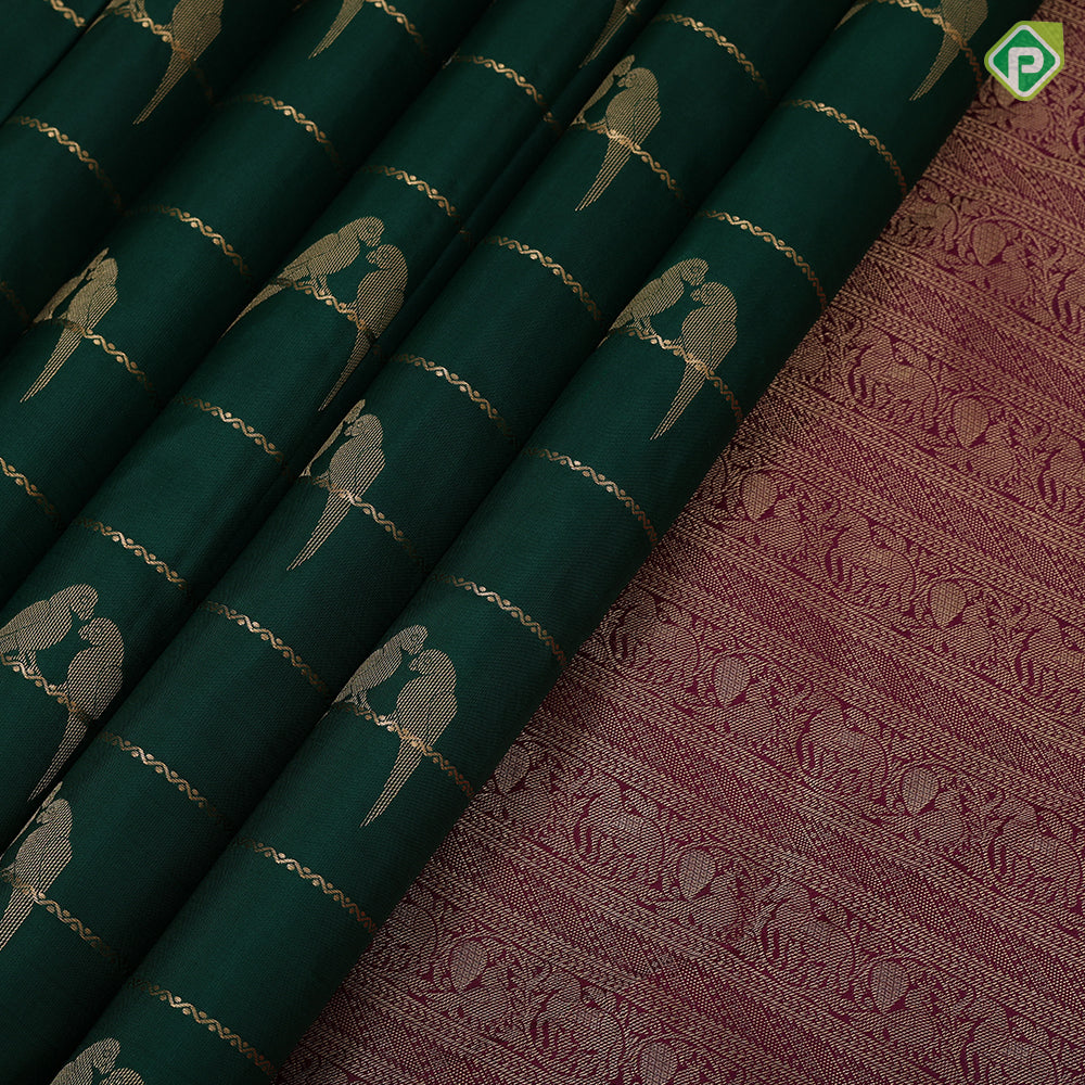 bottle green gold zari velthari lines double parrot butta purple gold zari vanasingaram border traditional silk saree