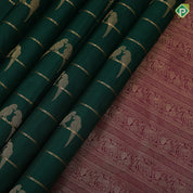 bottle green gold zari velthari lines double parrot butta purple gold zari vanasingaram border traditional silk saree