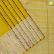 Lemon yellow silver zari fancy flower butta self silver zari and multi color butta border traditional silk saree