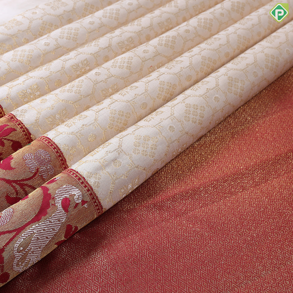 Creamy Sandal With Green Colour Pythonic Design Border Grand Bridal Silk Saree