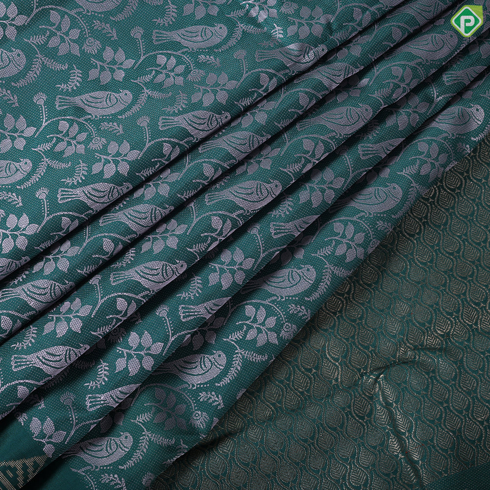 Pine green cream sparrow embossed design self gold zari drop butta border trendy silk saree
