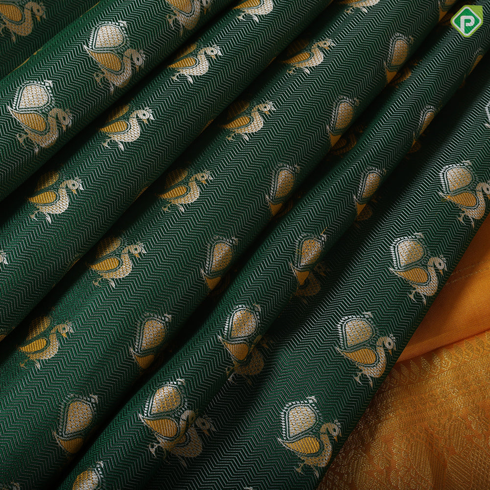 Pine Green peacock embossed butta design contrast mustard gold zari peacock butta border trendy silk saree