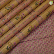 golden yellow with light pink flower bunch in frame design pink gold zari elephant and floral butta border tissue silk saree