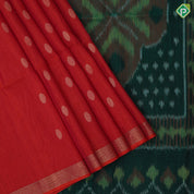 Tomato red gold zari chakkaram butta motifs self gold zari lines border bottle green ikkat style pallu linen soft silk saree