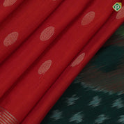 Tomato red gold zari chakkaram butta motifs self gold zari lines border bottle green ikkat style pallu linen soft silk saree