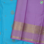 Sky blue gold zari Thilagam flower butta design lavender gold zari three line design border traditional silk saree