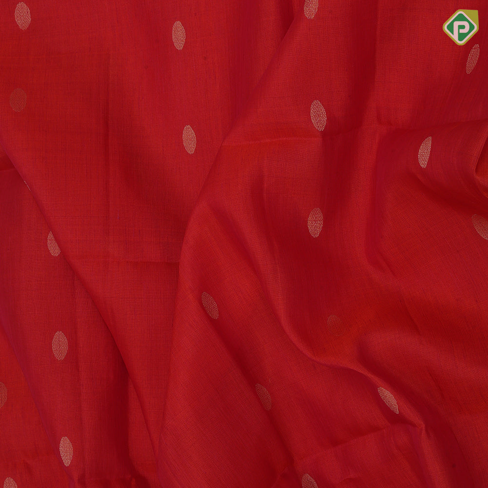 Tomato red gold zari chakkaram butta motifs self gold zari lines border bottle green ikkat style pallu linen soft silk saree