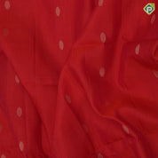 Tomato red gold zari chakkaram butta motifs self gold zari lines border bottle green ikkat style pallu linen soft silk saree
