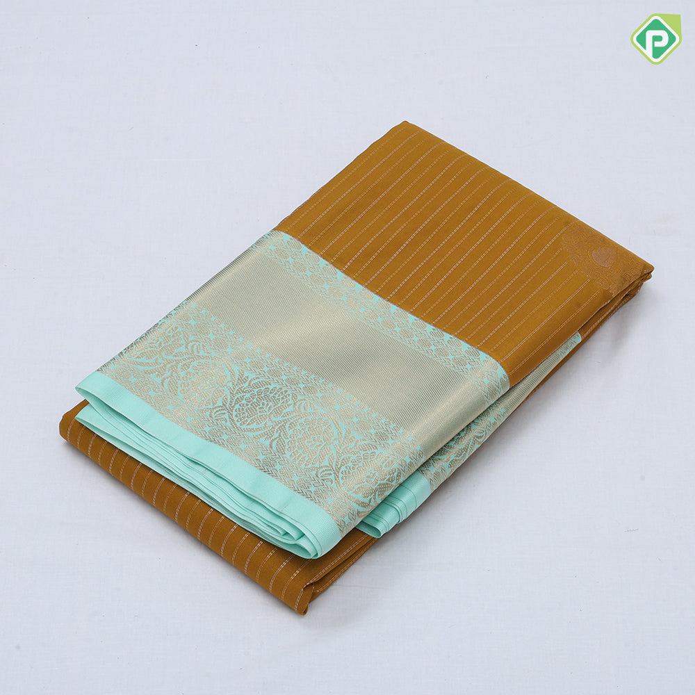 Mustard yellow gold zari stripes big thilagam butta pista green gold zari rangoli design border art silk saree