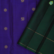 Indigo blue gold zari rudraksham annam butta motifs contrast green gold zari retta pett border traditional silk saree