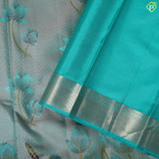 greyish green lotus flower embossed design peacock green gold zari border trendy silk saree